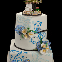 Last Wedding For Today fondant cake, gumpaste flowers and accent designs. Topper is ceramic.