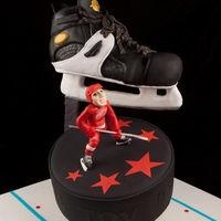 Hockey Bar Mitzvah Cake Customer came to us looking for a very special cake for their son's Bar Mitzvah. The theme: Hockey. The Team: Red Wings. What better...