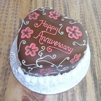 Parent's Anniversary Cake Small heart covered in chocolate MMF. Decorated with RI. First time I have done the brush embroidery since taking the Wilton class nearly...