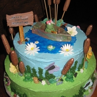 Fishing white cake with fondant accents and buttercream iceing all is edible.