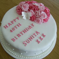 Cluster Of Roses Birthday Cake Lemon drizzle birthday cake with sugar roses and pearls