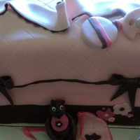 Diaper Bag Cake Pink and brown fondant covered diaper bag with gumpaste pacifier, rattle and teddy bear