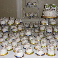 Beach Wedding Beach Wedding cake surrounded by 140 mini cakes. Hand maade chocolate clay shells and pearls. Chocolate, pistachio and french vanilla...