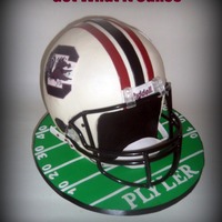 Go Gamecocks! This cake is a true to size football helmet. It's 5 layers (about 2 in. each) of 10 inch rounds stacked. Two layers (with bubble tea...