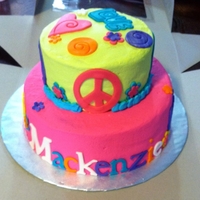 Love Peace tye dye cake inside, CC icing. Fondant accents. Used cookie cutters for cut outs and my cricut cake
