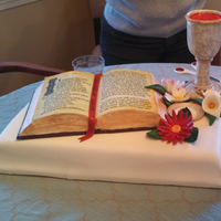 First Communion 2013 The base is chocolate cake covered in fondant. The bible is carved pound cake, with frosting and fondant. The text on the bible is an...