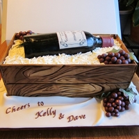 Wine Bottle Cake Wine bottle cake for a bridal shower. Dried panel crate, edible image label, RKT bottle covered in fondant, white chocolate shavings,...