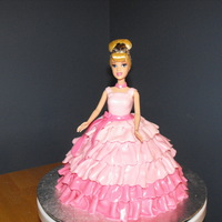 Pink Cinderella Doll cake for my daughter's 4th birthday - she wanted a pink Cinderella. Used a Cinderella doll but took off her legs before inserting...