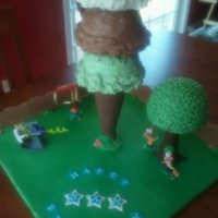 Phineas & Ferb World's Biggest Ice Cream Cone Cake Inspired by the ice cream cone cakes here on CC. Buttercream "ice cream" scoops, cone is styro covered in fondant, fence is...