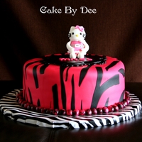 Hello Kitty Zebra Cake Hello Kitty made out of gumpaste and cake covered in Duff fondant.