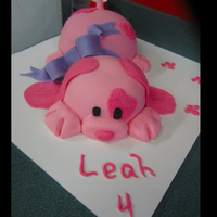 Pink Puppy Medium and large pyrex bowlsPaws and nose fondantBow/collar was needed to hide separation of two cake