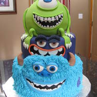 Monsters University all Edible. Sully covered in b/c with rkt eyebrows & fondant accents. mike is all cake covered in fondant w/ fondant accents. middle...