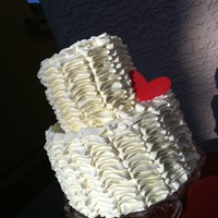 Tiered Ruffle Cake Yet another ruffle cake! This was a tiered buttercream ruffle cake for an anniversary. Finished with a fondant heart. I just loved how easy...
