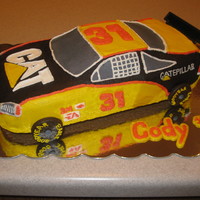 Cat Racing Spice cake frosted and decorated with buttercream