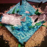 Fishing This is my 1st fishing cake. Was a learning experience. Chocolate cake with buttercream. Airbrushed (Wilton spray) buttercream. Fish is RKT...
