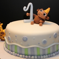 Animal Theme First Birthday Cake This cake was red velvet with cream cheese and whipped icing, and was for a little boy's first birthday!