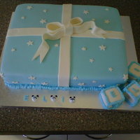 Cake For Baby Eli 3 layered vanilla cake with vanilla buttercream icing, covered in fondant with fondant bow and decorations