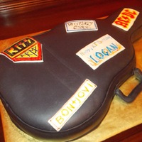 Fondant Covered Guitar Case With Fondant Band Stickers For 10 Year Old Fondant covered "guitar case" with fondant band "stickers" for 10 year old.