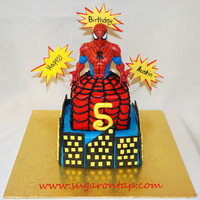 Spiderman Cake VBC over chocolate cake. Fondant accents. Spiderman upper body is actually a plastic piggy bank I found at my local Target and decided to...