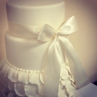 Weddings Three tier rose petal cake I got inspired by one I seem on a magazine.It's adorned with a simply perfect satin bow. # round wedding...