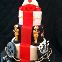 Red Carpet Nursing Going away cake for a beloved nurse. Film reel is gumpaste and has edible gelatin film on it. Clap board is gumpaste and was inspired by...