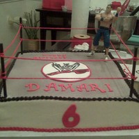 John Cena Yellow cake with french vanilla buttercream. WWE emblem made from fondant & handpainted. John Cena wrestling figurine purchased from...