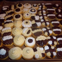 Just Cupcakes Yellow cupcakes with an assortment of frostings. Cream cheese, chocolate, chocolate fudge, and buttercream.