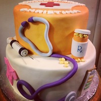 Nursing School Graduation Cake Cake for a nursing student graduation party. Vanilla cake with Italian meringue buttercream and fresh strawberries. Gumpaste decorations....