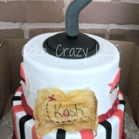 Pirate Theme 2 tiered cake for 2 brothers. Covered in BC with fondant stripes, pirates, and hook. Maps are rice paper.