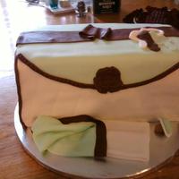 Diaper Bag cut and stacked red velvet cake covered in MMF with all MMF accents