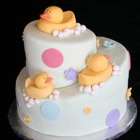 Rubber Ducky Topsy-Turvy Baby Shower Cake Oh, I just love this one! I worked hard to improve my rubber ducks. My first cake I used modeling chocolate and I didn't love it. This...