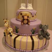 Girly Jungle Themed Cake Girly jungle themed cake, pink champagne cake with raspberry cheesecake mousse filling covered in buttercream and lemon flavored fondant....