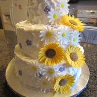 Rustic Sunflowers, Daisies And Small Purple Blossoms 12", 10" and 6" Vanilla cakes. Flowers are made with homemade marshmallow fondant. A few weeks ago I purchased Tylose online...