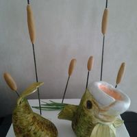 Bass Rice krispie bass covered in fondant with cattails. Everything is edible but sticks. Thank you to tchitwood on instructables for the...