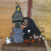 The Nightmare Before Christmas House is styrofoam covered in gumpaste. Jack and trees are shaped wire covered in gumpaste, other accents are fondant.