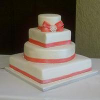 Bling Bling Coral Wedding Cake Pink Lemonade and Butter Vanilla cakes covvered in mmf. MMf accents and rhinestones.