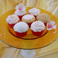 Pink Champagne Beauties Delicate sugar flowers, pearls, glitter, & swirls and ruffles of Strawberry Pink Champagne buttercream adorn these Pink Champagne...