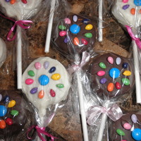 Daisy Scout Cake Pops Chocolate and vanilla cake pops decorated with the daisy made from candy coated sunflower seeds and an M&M center.....its for the...