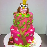 Baby Owl Cake The cake is iced in butter cream and the owl is rice krispie treats covered in fondant,