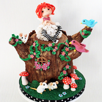 Tree Trunk Fairy Cake for my niece, I made the Tree Stump out of cake and chocolate ganache, the rest of the details are hand sculpted :) Enjoy!