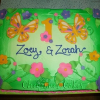 Butterfly Twins made for twin girls first birthday. All detail work(flowers, butterflies ect) are made with modeling chocolate.