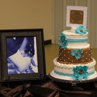 Turquoise And Brown! Turquoise and brown tiered bridal cake. Iced in BC with fondant accents.