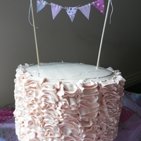 Ruffle Cake White Chocolate mud cake (done in pink ombre layers) with white chocolate ganache, raspberry jam and raspeberry swisse meringue buttercream...