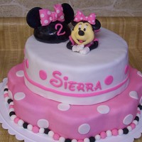 Minnie Mouse Minnie Mouse cake for the daughter of a friend. Minnie is gumpaste/fondant mix, mouse ears hat is molded rice krispy treats with gumpaste...
