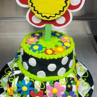 Flower Power Two tier round and square cake with daisy topper.