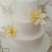 Yellow Orchid Wedding Cake I threw this together in a rush as I needed another dummy cake for a wedding fayre in February. I wanted something simple and sunny and...