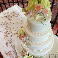 Antique Tea Cup Wedding Cake 4 tier wedding cake, with roses, freesias and mini guitars for an 'antique tea party' wedding theme. I made the guitars as a...