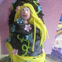 Rapunzel My daughter wanted Rapunzel for her birthday cake. The cake had to have a big tower! Here it is all edible. This is the first time I made a...