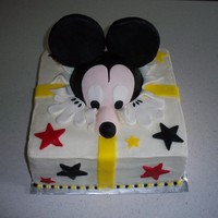 Mickey Present Mickey coming out of a present. Head and ears are RKT covered in fondant.