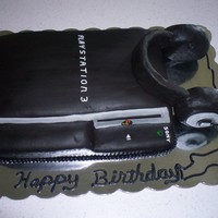Ps3 White Cake covered in Black fondant with RKT for the headphones!!!